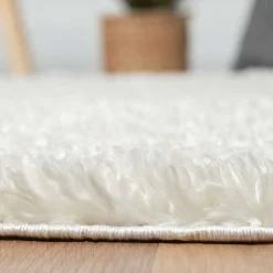 Cremefarbener Teppich mit hohem Flor - Vacance^Wohnen