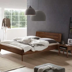 Wohnen Dunkles Holzbett aus Nussbaum Massivholz - Vetonia