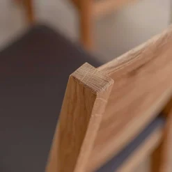 Wohnen Esstischstuhl aus Wildeiche mit Kunstleder Sitz - Ernestan